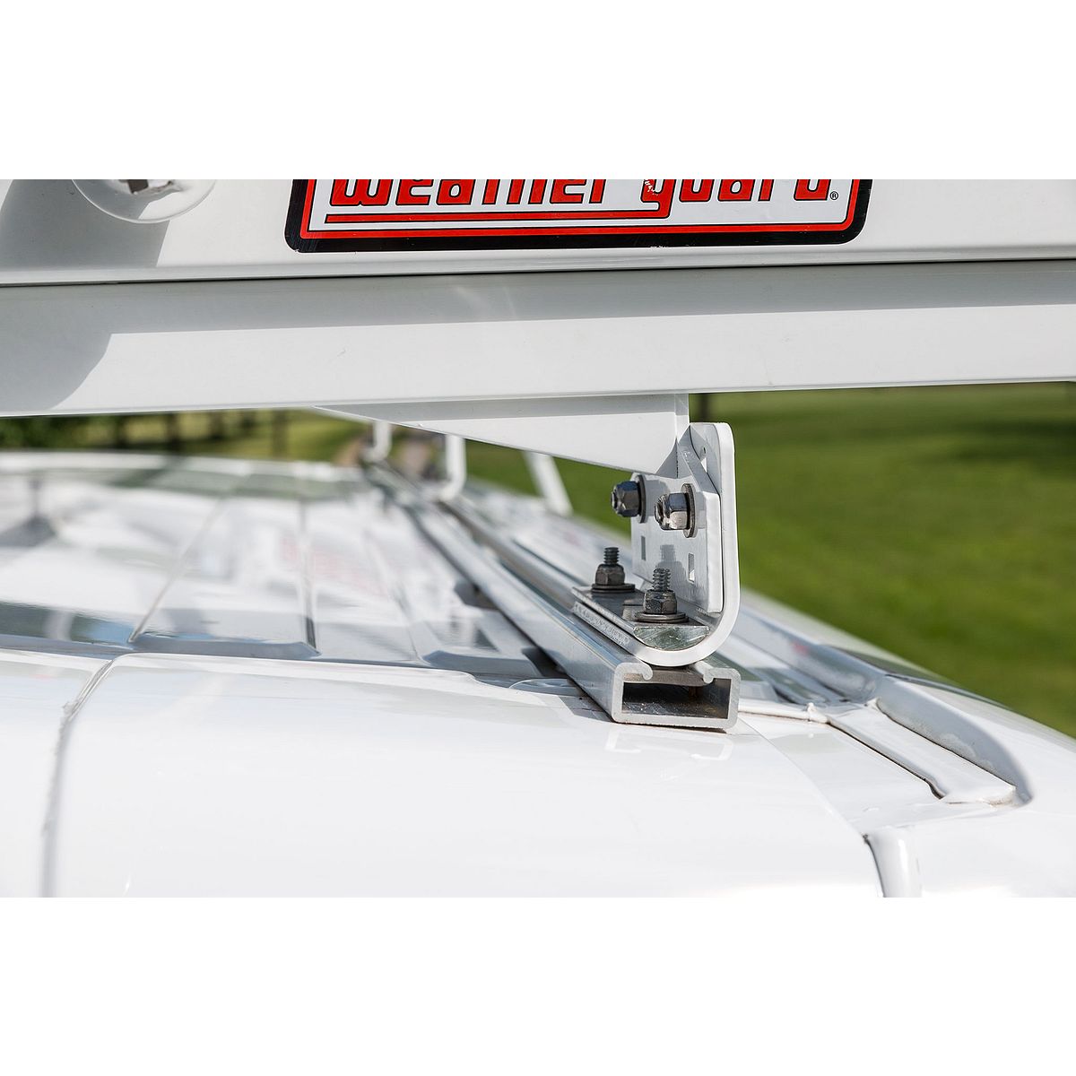 Weather Guard EZGLIDE2 ladder rack installed on a work van roof